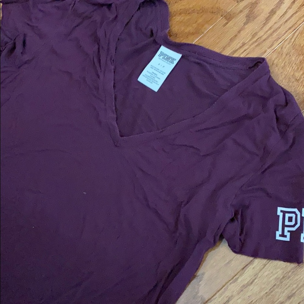 Maroon vs pink v neck tee shirt with logo sleeve